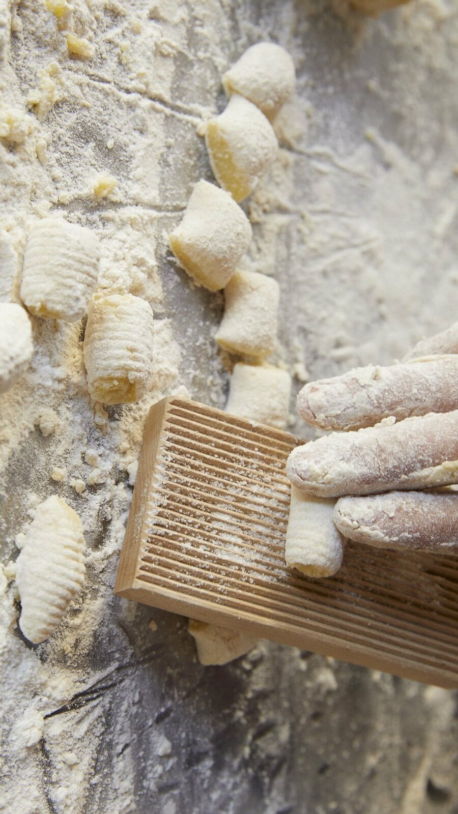 person making fresh pasta