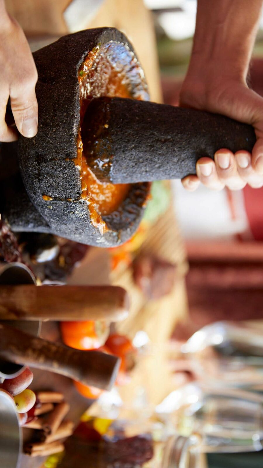 person mashing ingredients in bowl