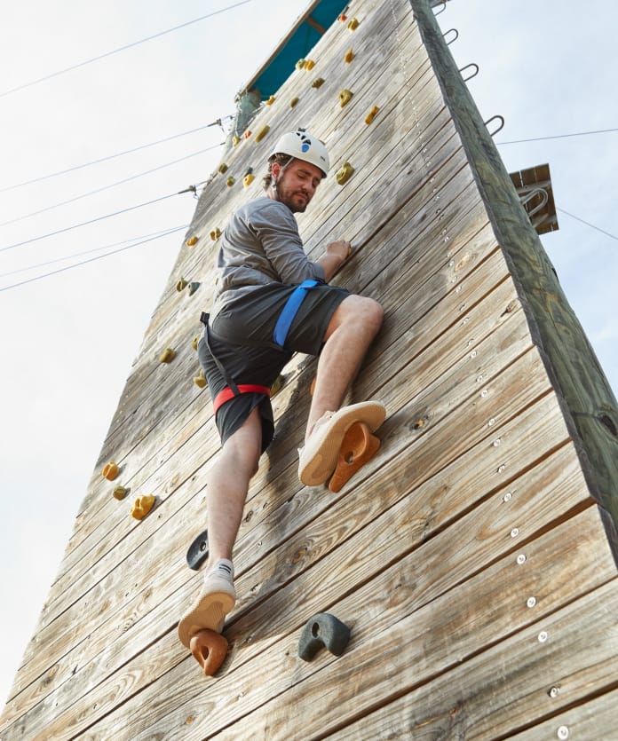 person rock climbing