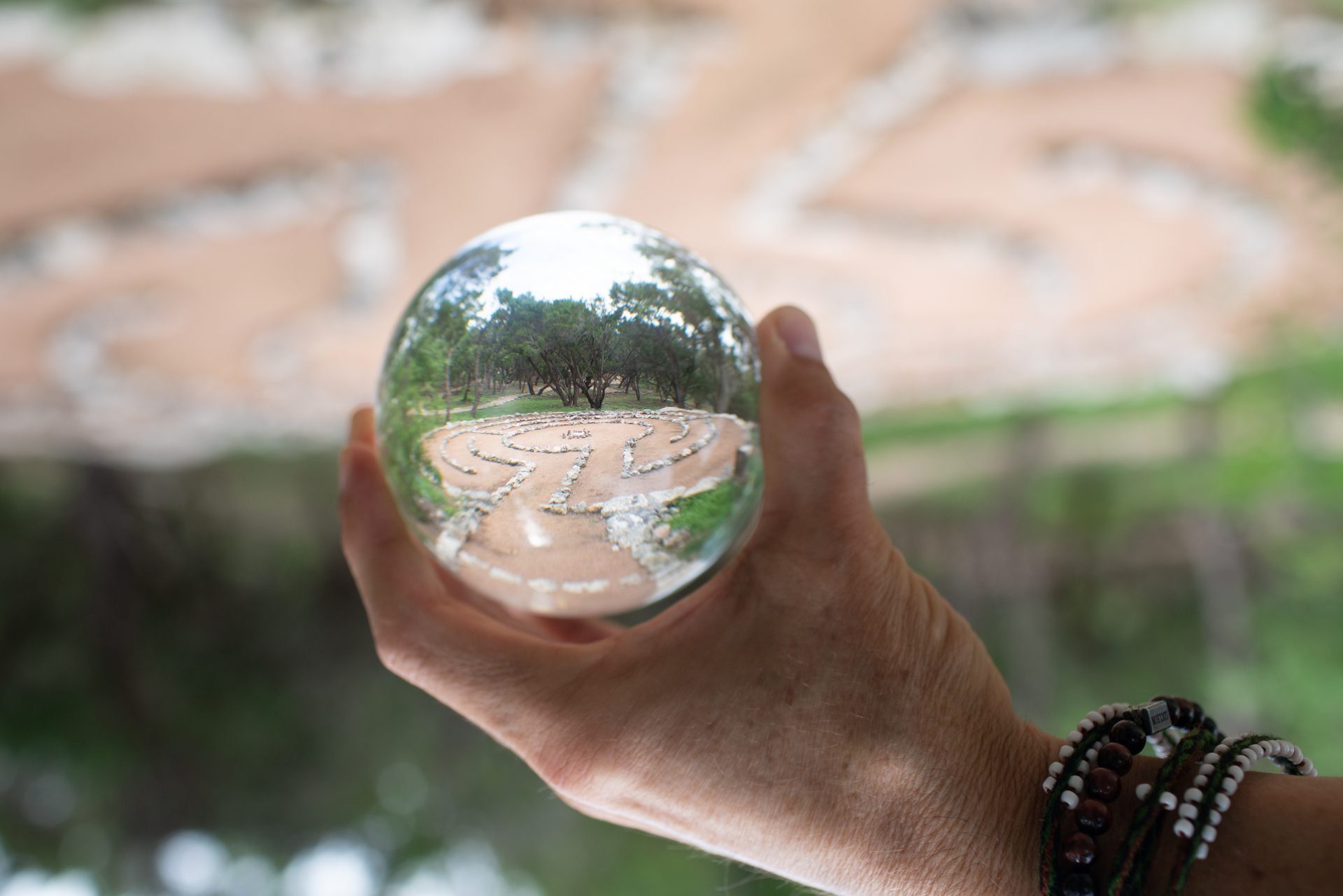 Hand holding crystal ball