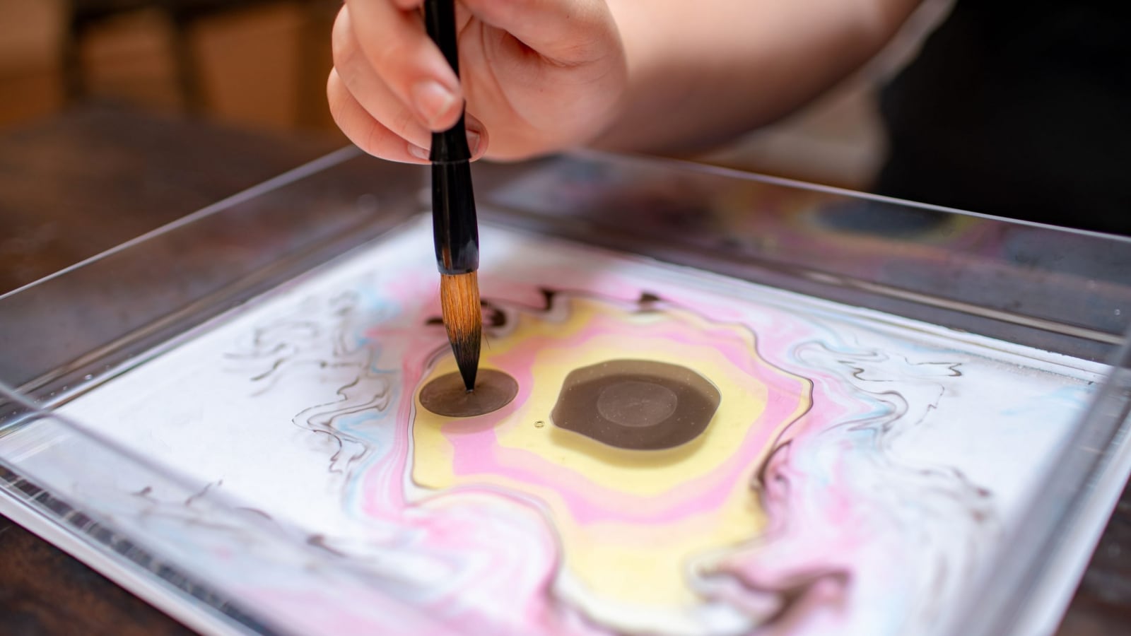 person painting with a paint brush