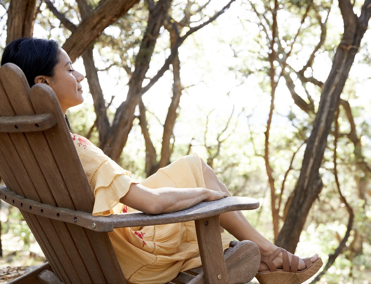 person sitting outside on chair relaxing