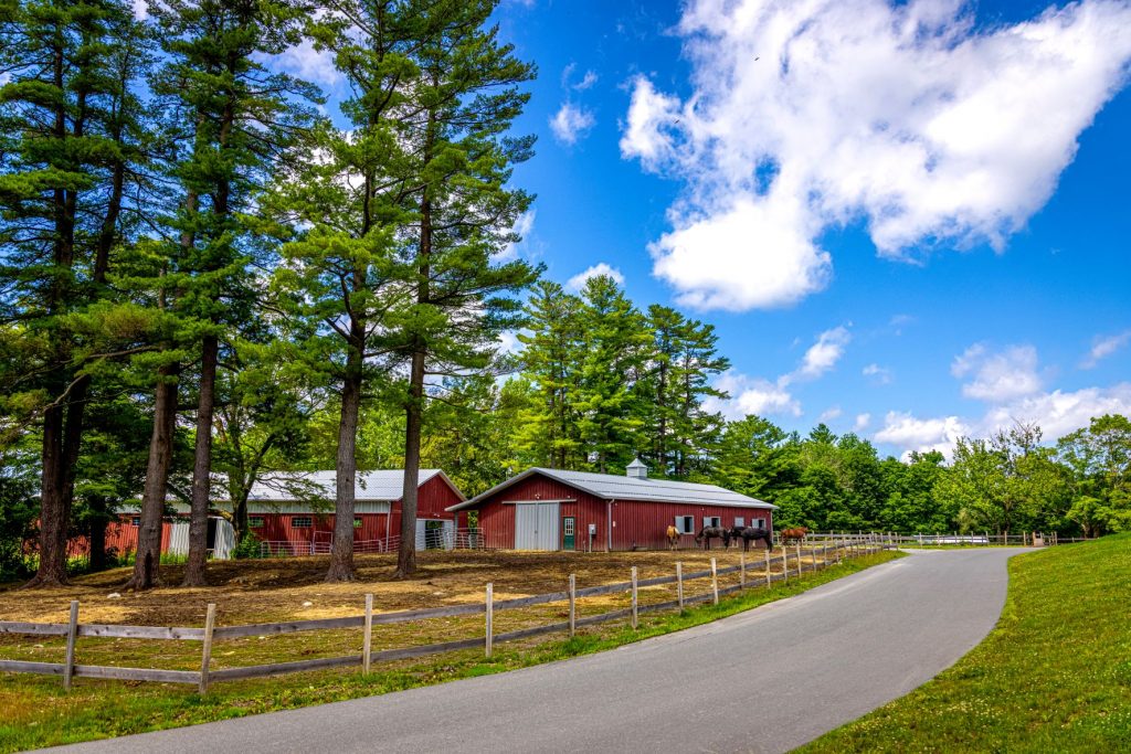 exterior view of red barn and path